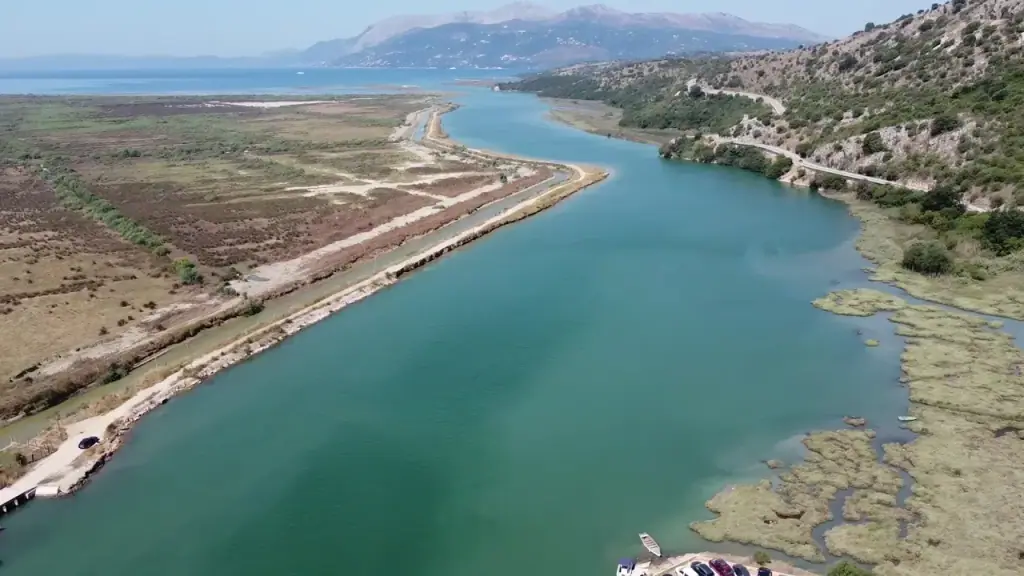 Aerial view over the Vivari channel and the wooded Butrint peninsula south of Saranda, water winding between green headlands