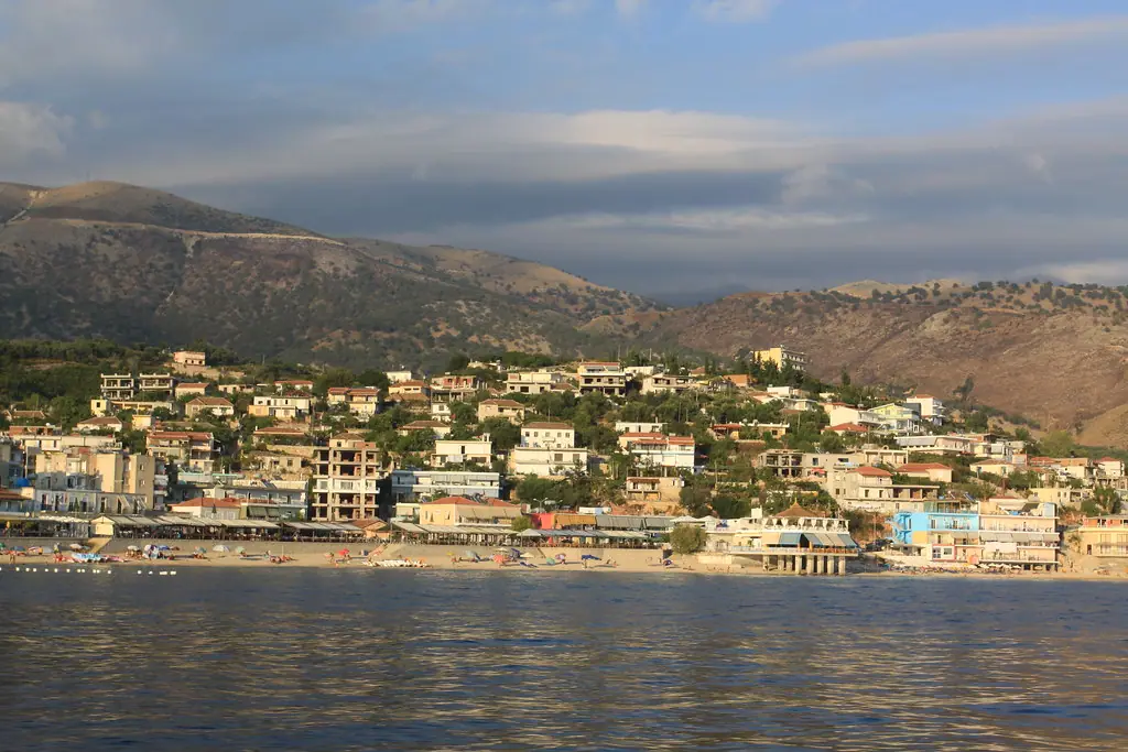 Boat tour passengers cruising the Himara coastline on the Albanian Riviera