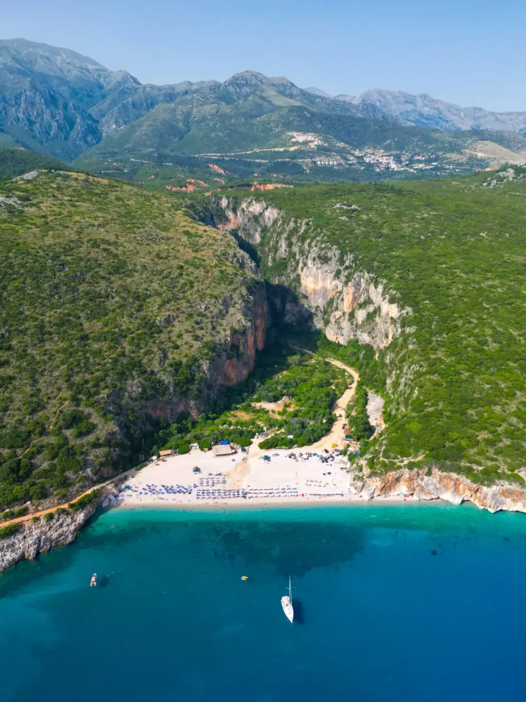 Gjipe Canyon dramatic limestone cliffs descending to the sea on the Albanian Riviera