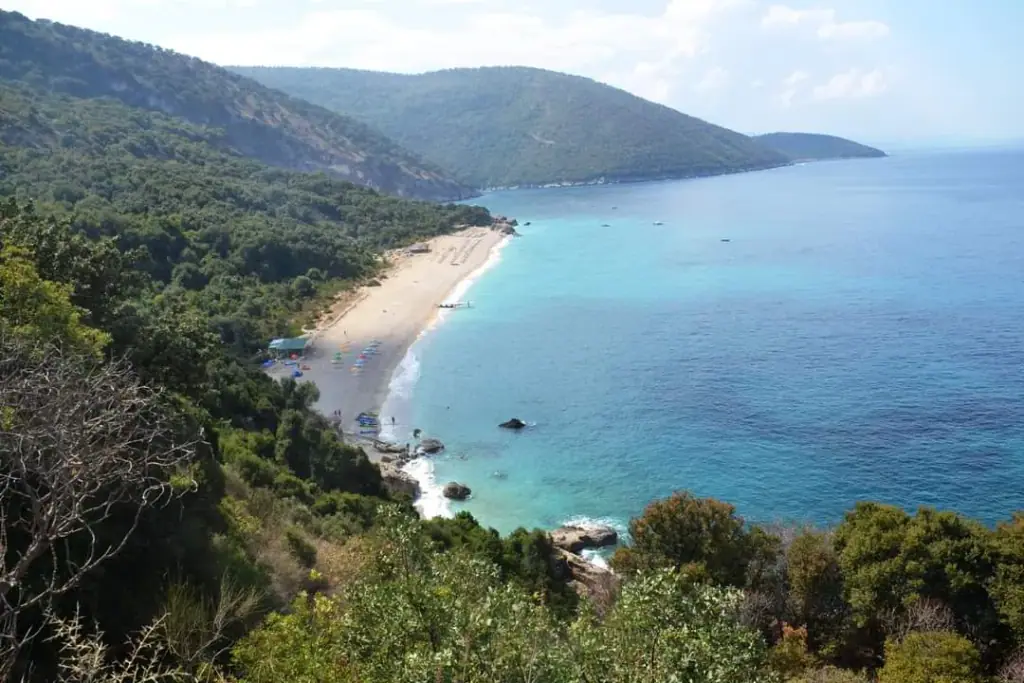 The secluded white-pebble cove and turquoise water of Krorëza Beach on the untouched far-south Albanian coast