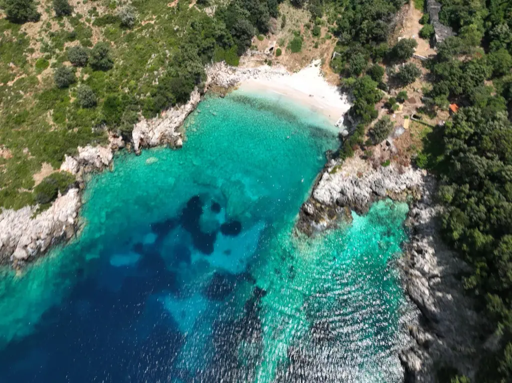 Bear's Bay from the ridge, turquoise water against pale rock