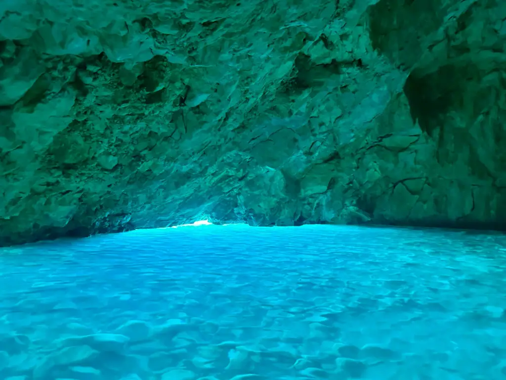 Brilliant blue-green water inside the Blue Cave