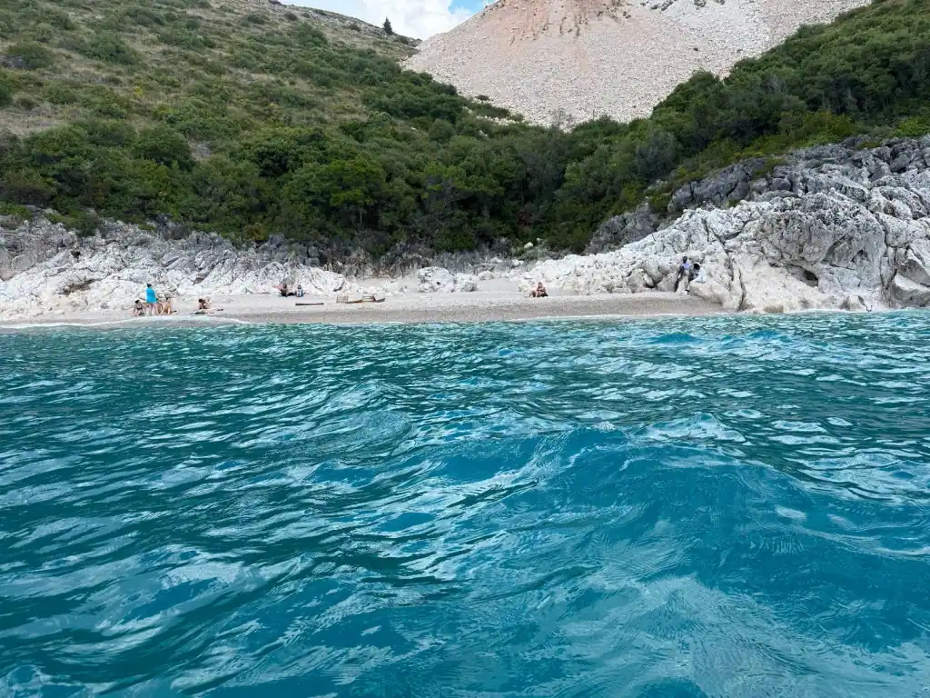 White pebbles and bright turquoise shallows at Crystal Beach