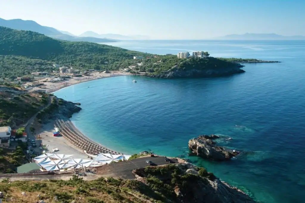 Jale Bay from the hillside with the beach curving around turquoise water