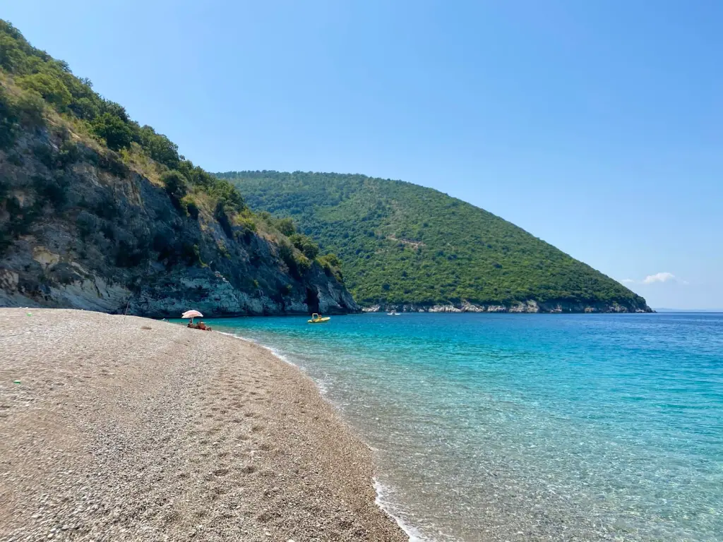 The pebble shore at Krorez with clear shallow water