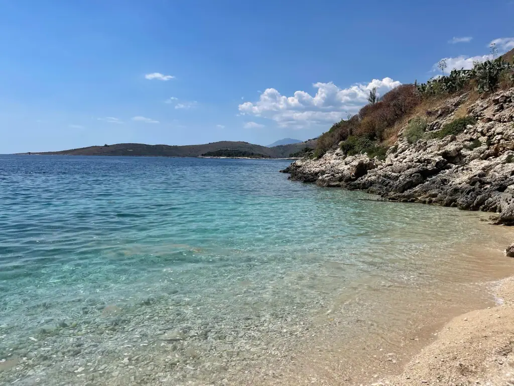 Porto Palermo bay and its headland above clear turquoise water