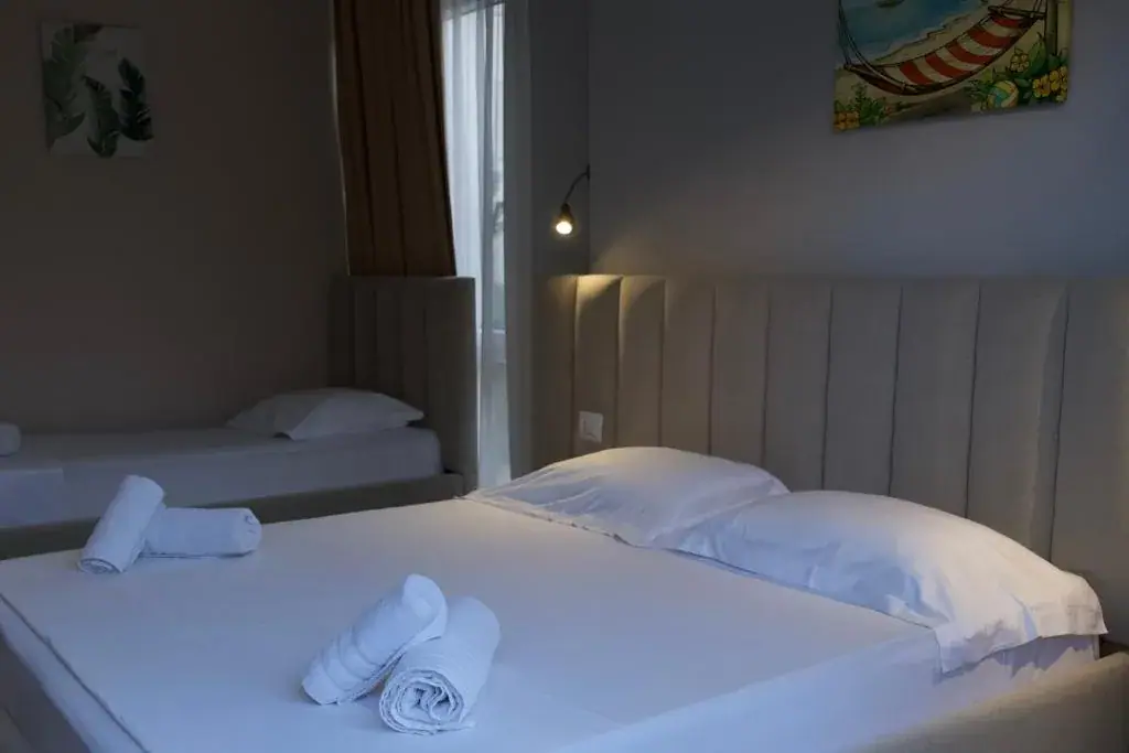 Deluxe Triple Room with Private Veranda at The Blue Wave Hotel