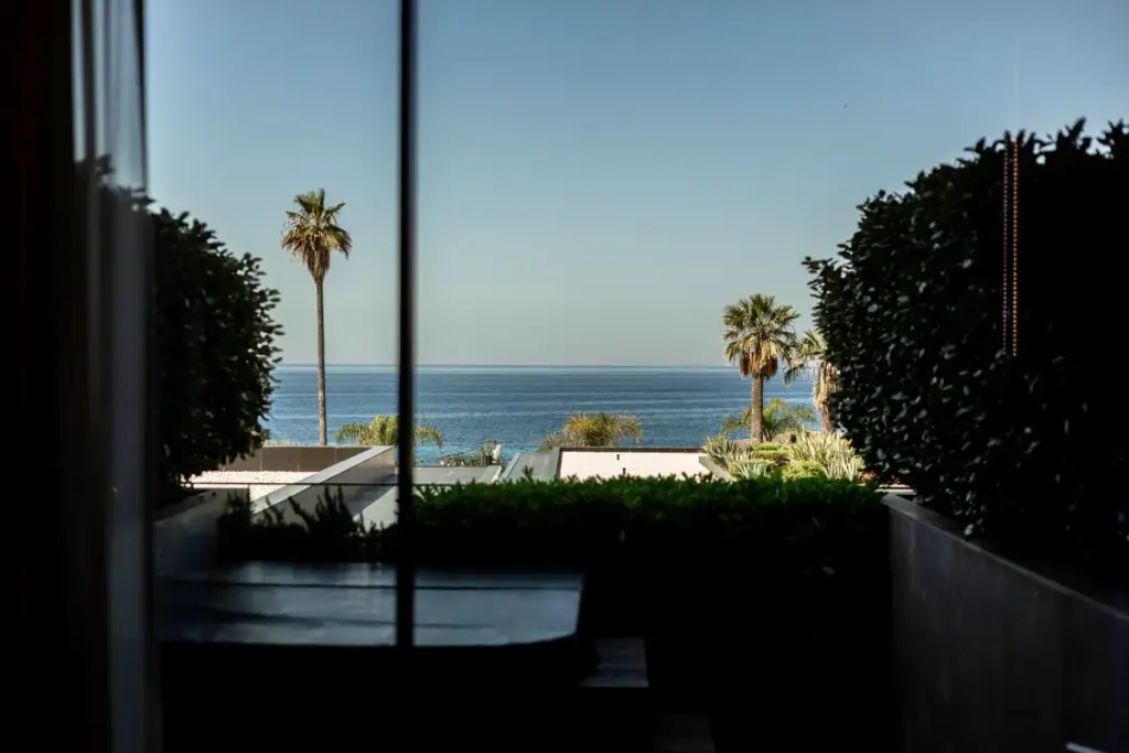 Infinity pool at Prado Luxury Hotel overlooking Livadhi Beach and the Ionian Sea