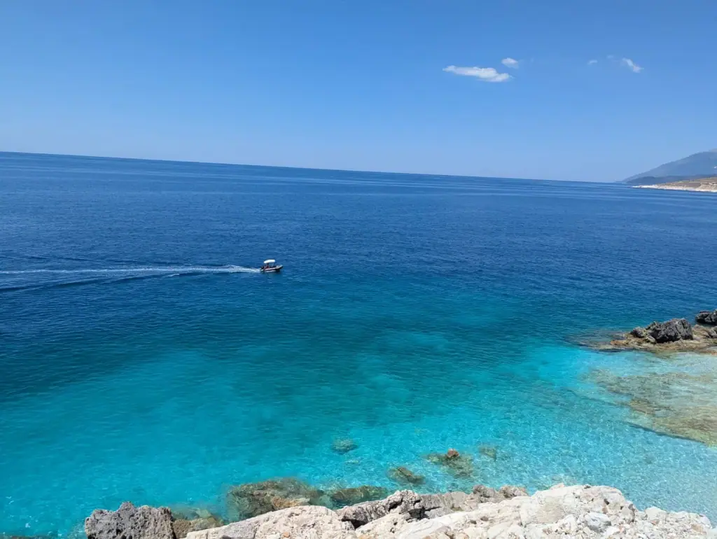 Amallos Beach secluded white pebble cove with clear turquoise water near Porto Palermo south of Himara