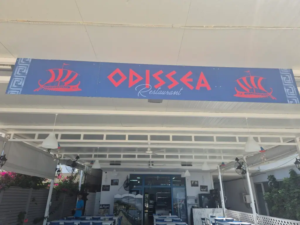 Entrance and signage of Restaurant Odissea in Himara