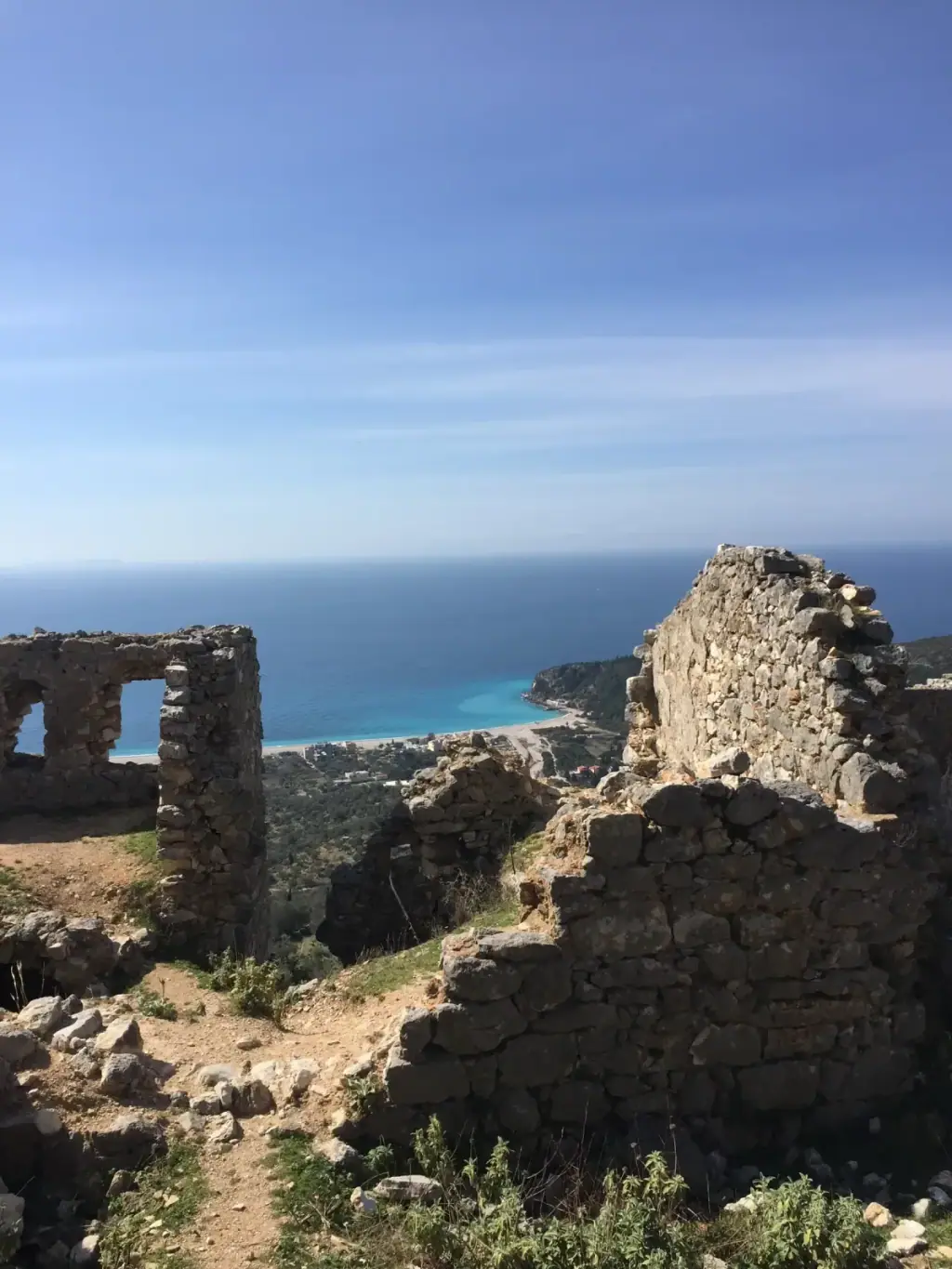 Stone walls and Byzantine church ruins at Himara Castle overlooking the coast
