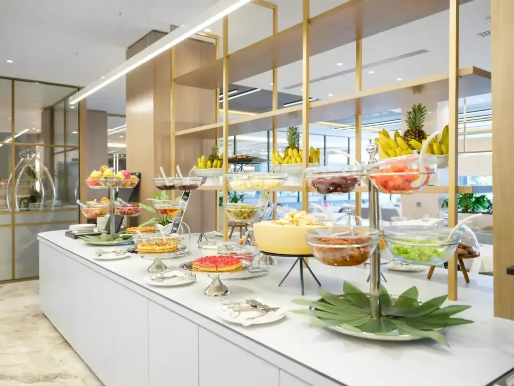The breakfast buffet counters at Prado laid with fruit, pastries and cold plates