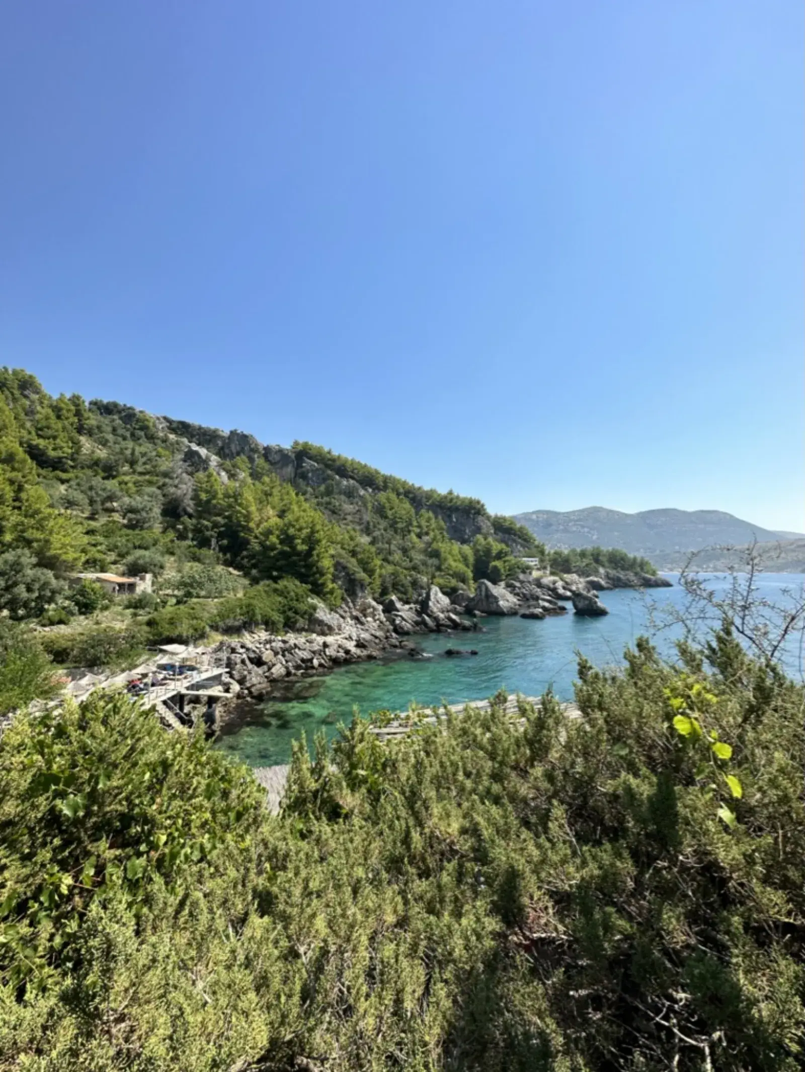 Himara town at sunset, accommodation market context for the Airbnb vs Booking decision in Albania
