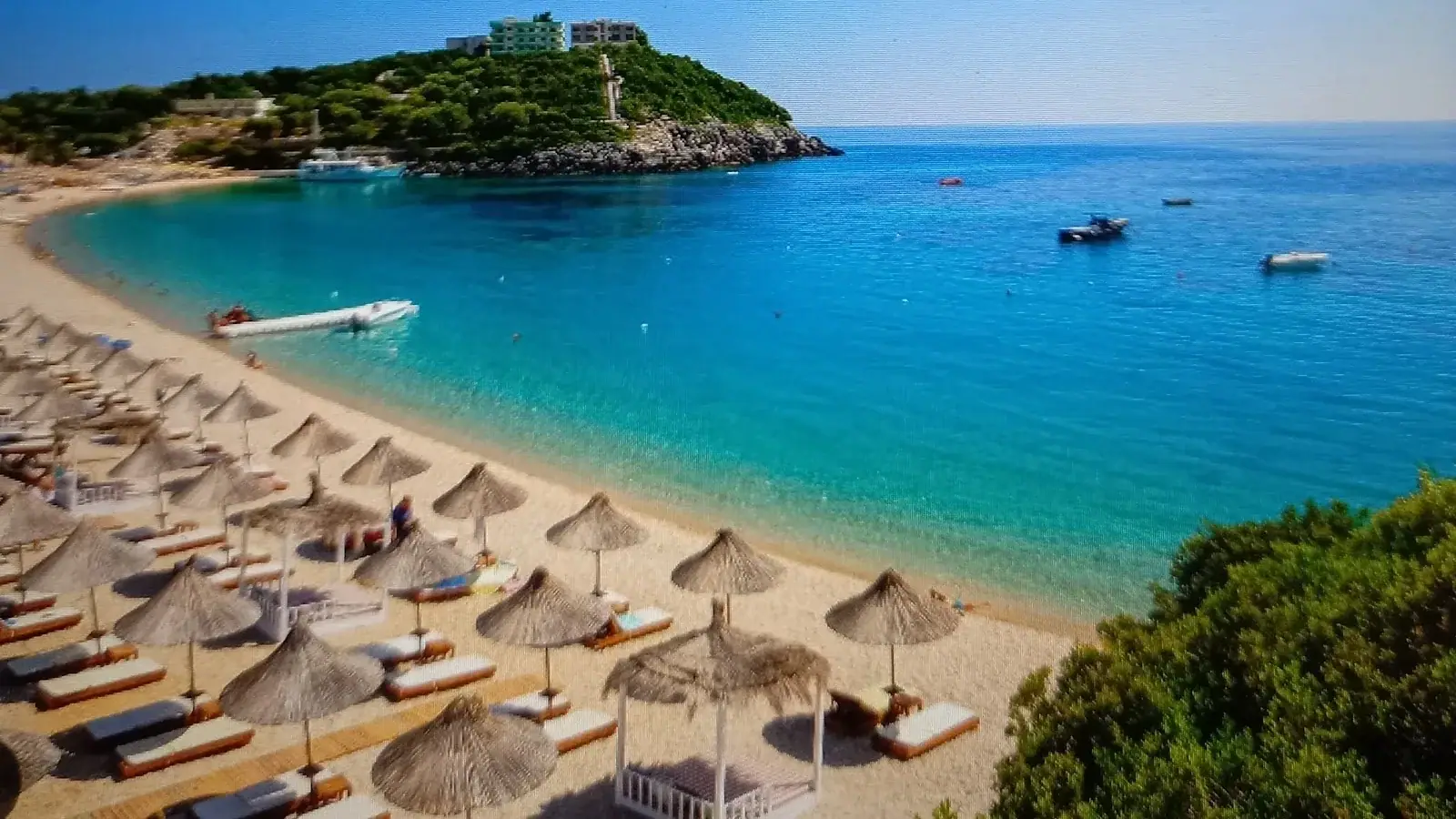 Summer beach scene in Jale suitable for backpacker travel on the Albanian Riviera