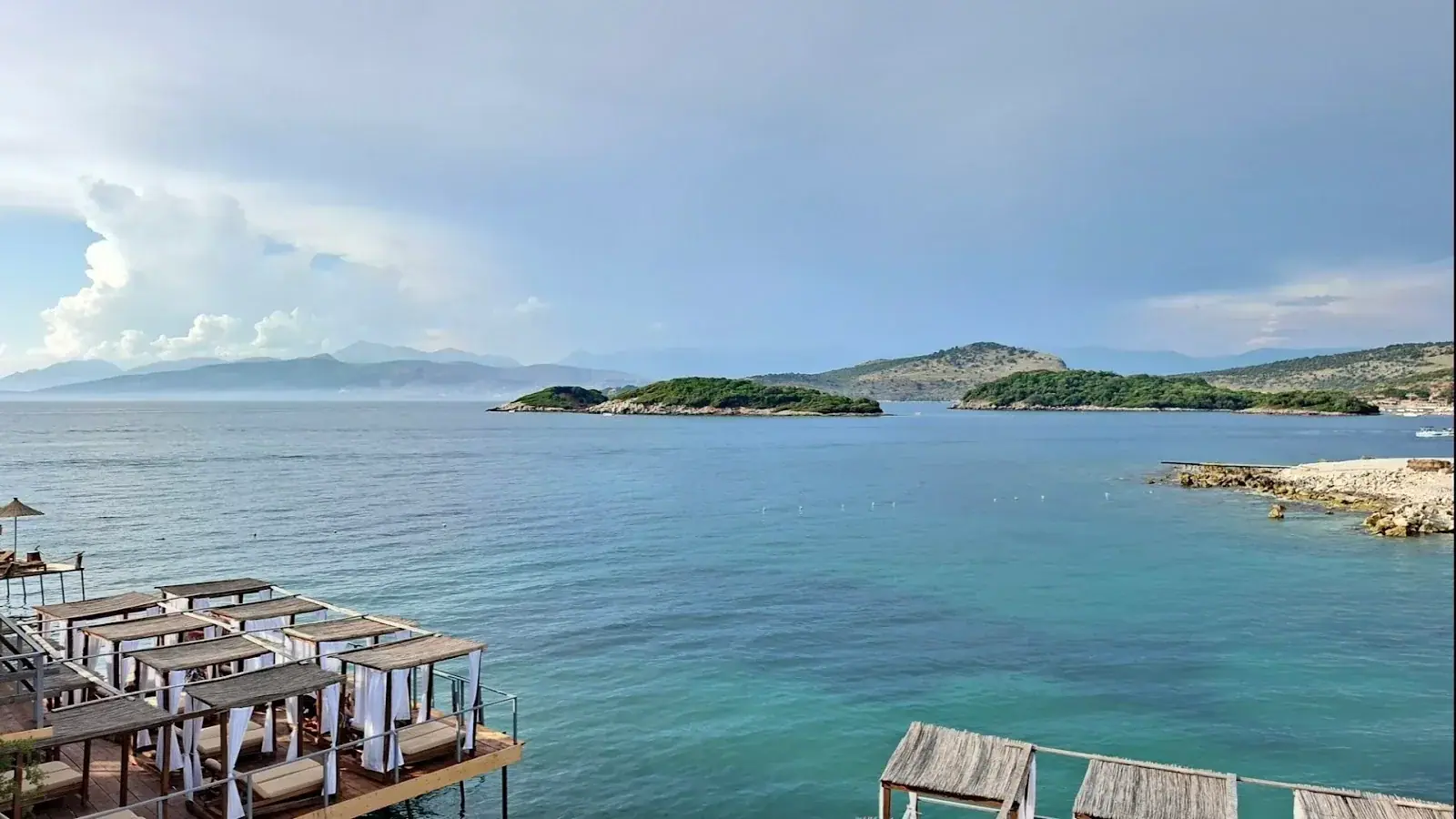 Hotels and turquoise shoreline in Ksamil