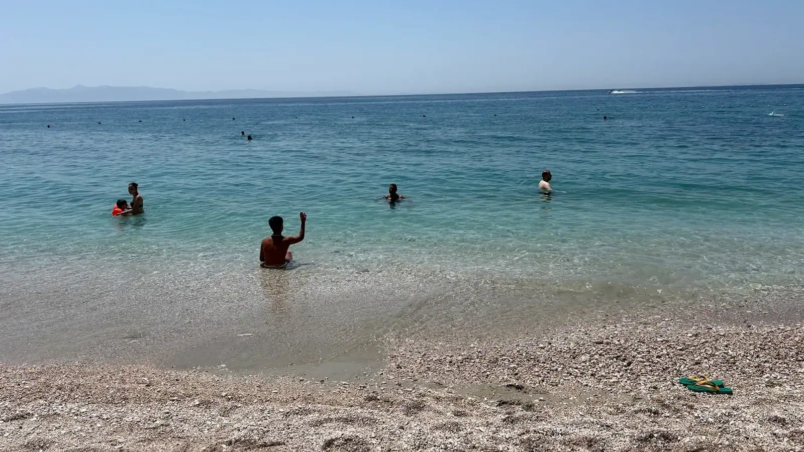 Exploring Himara Boat Trips vessel at a swimming stop on the Albanian Riviera coastline
