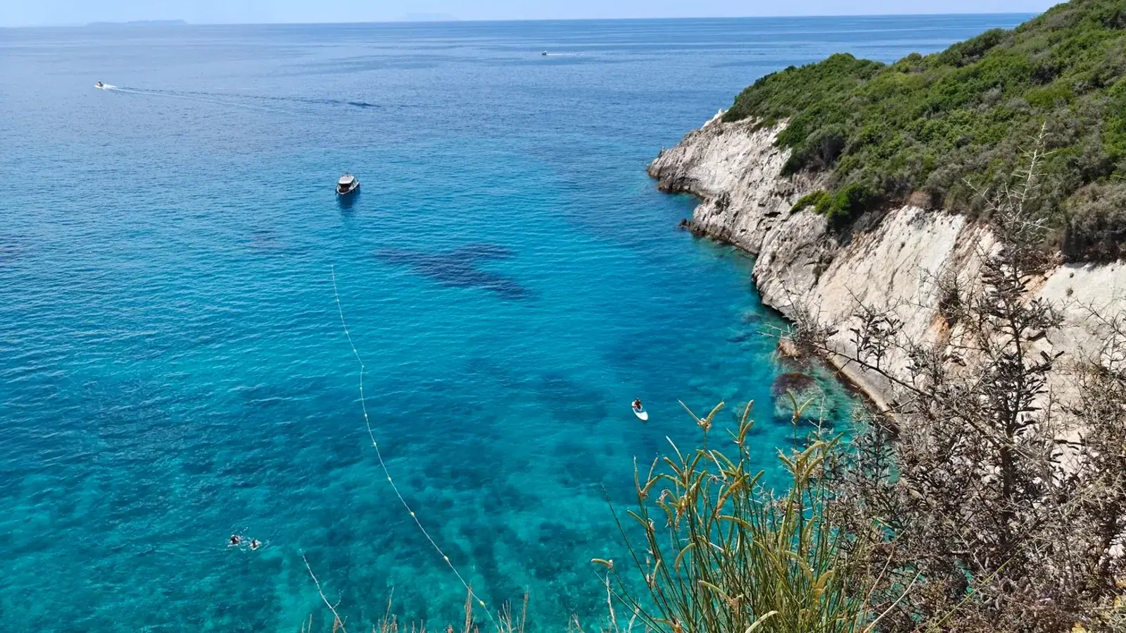 Camping setup on the Albanian Riviera with sea views and mountain backdrop