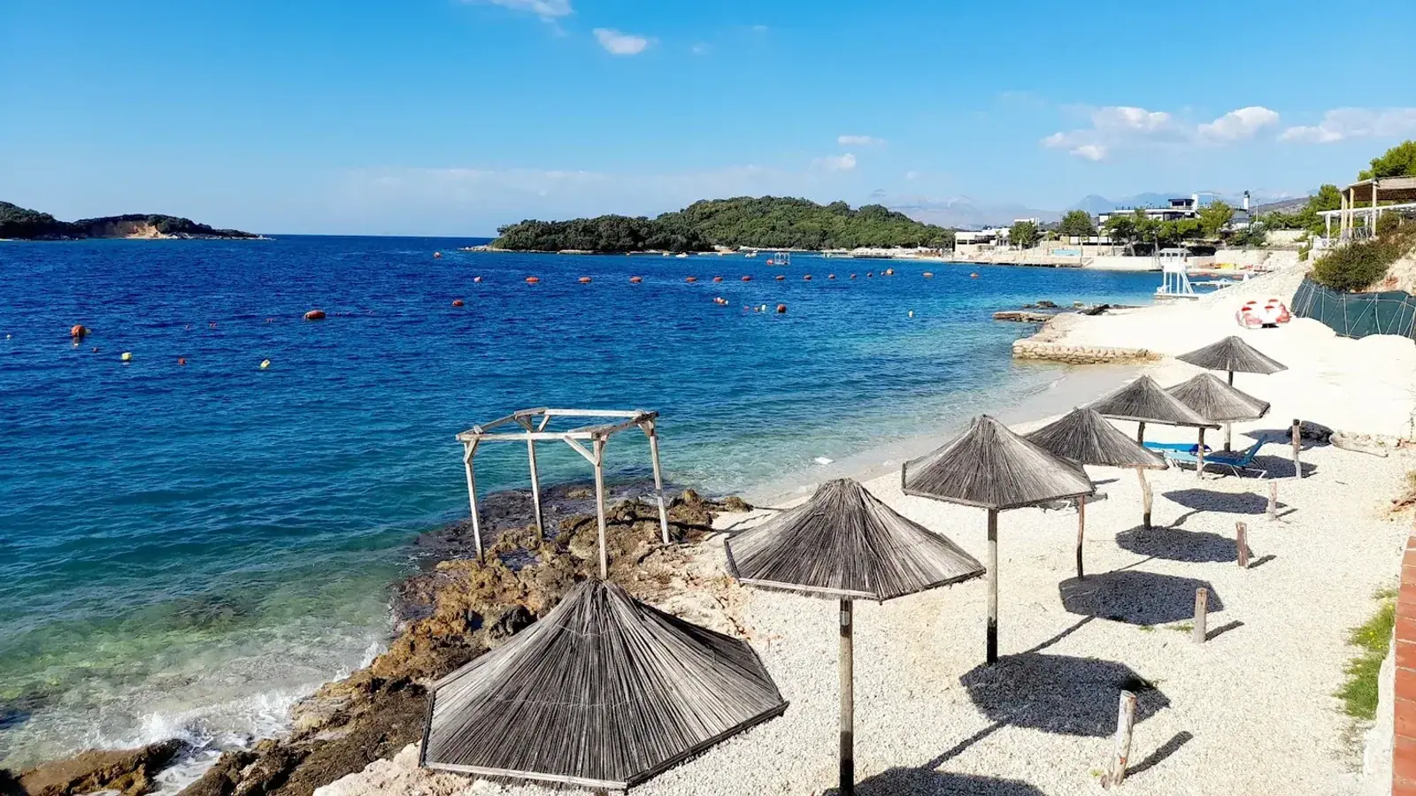 Spile Beach coastline view on a breezy day along the Himara waterfront