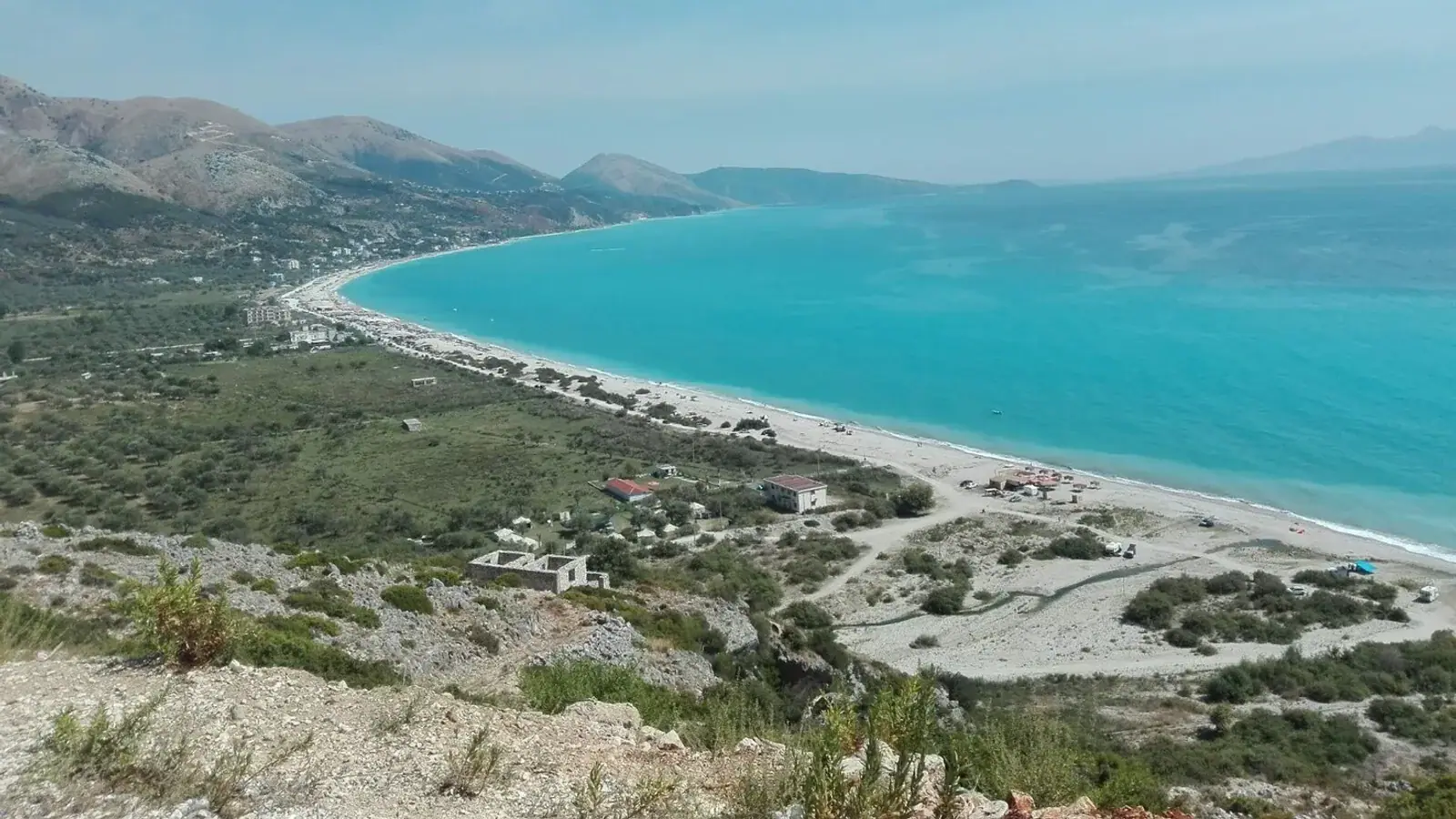 Rocky turquoise cove at Jale Beach showing the coastline north of Himara