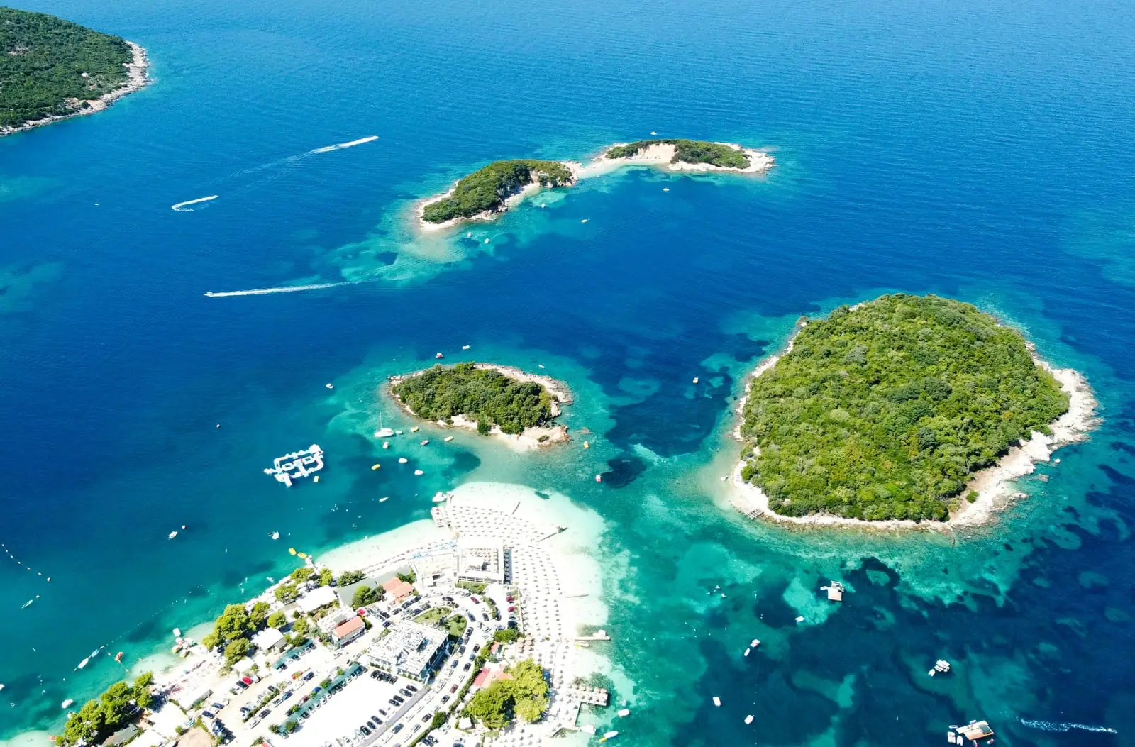 Aerial view of the Ksamil archipelago, four green islets in the turquoise Ionian Sea, southern Albania