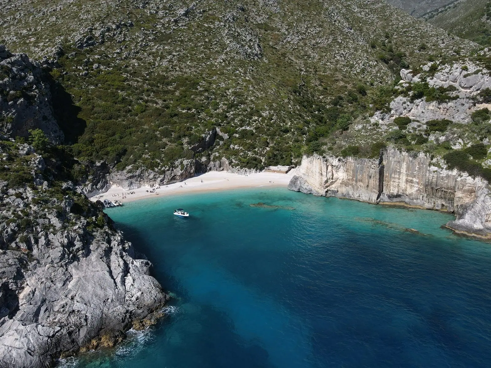 Aerial of the wild Karaburun cliffs facing the Adriatic, the coastline you sail past on the way to Sazan Island, Albania
