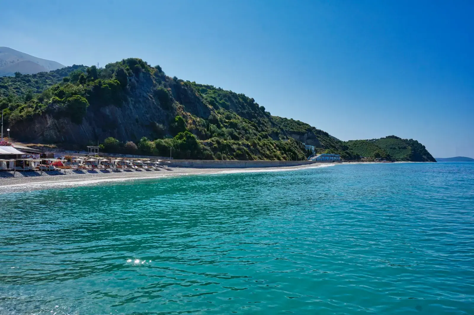Buneci Beach with vivid blue waters on a quiet stretch south of Borsh