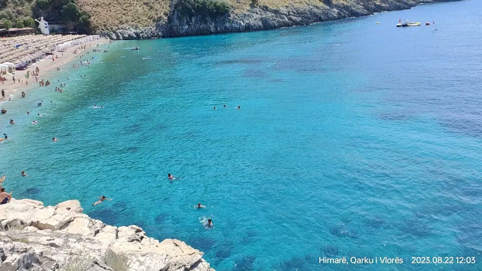 Llamani Beach sunbeds against the rocks
