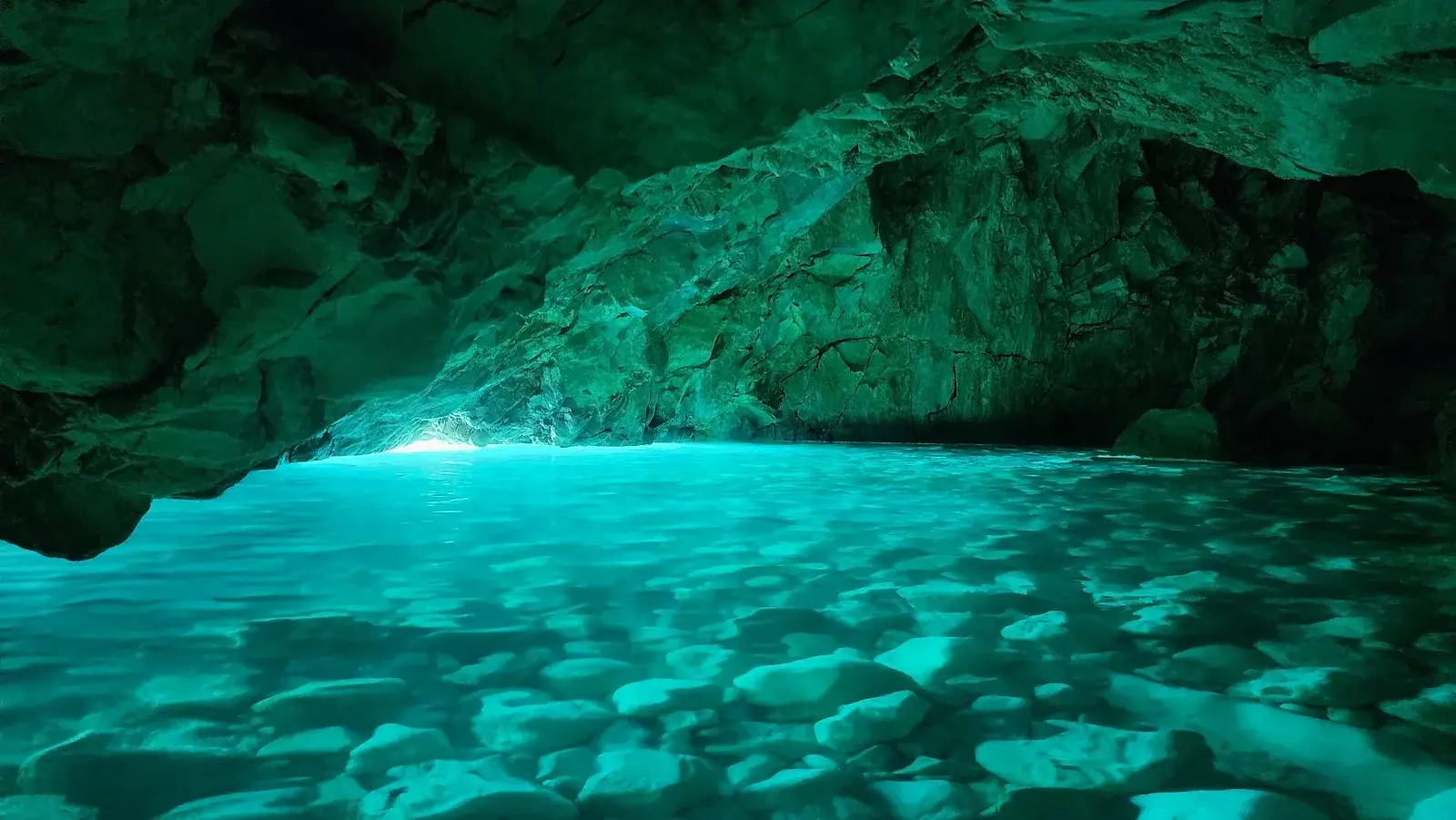Brilliant turquoise water inside the Blue Gem Cave