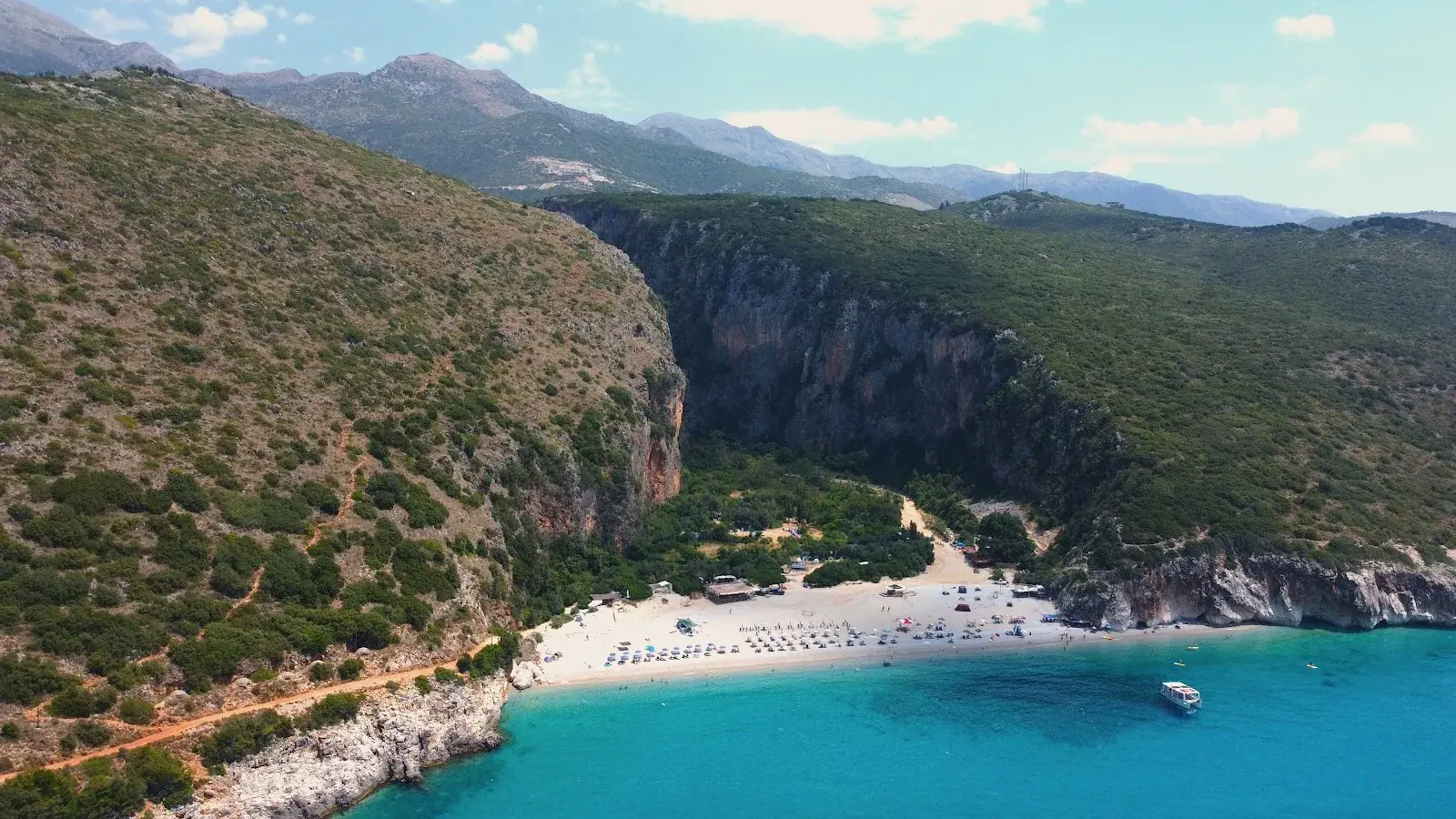 Aerial of Gjipe Beach where the canyon meets the sea