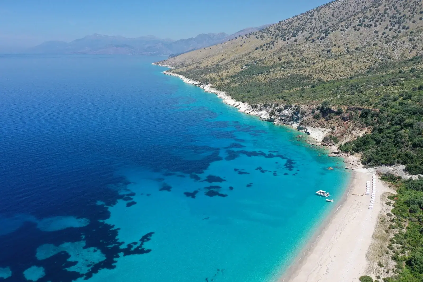 Aerial of Krorez Beach and its turquoise water