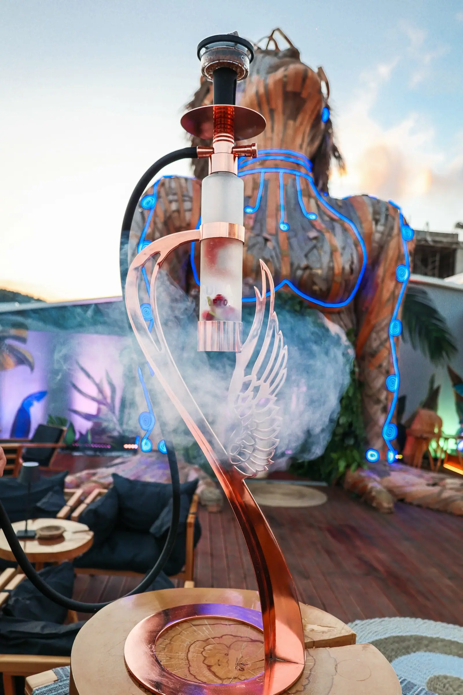 Coba Rooftop bar terrace with evening lights and bay views
