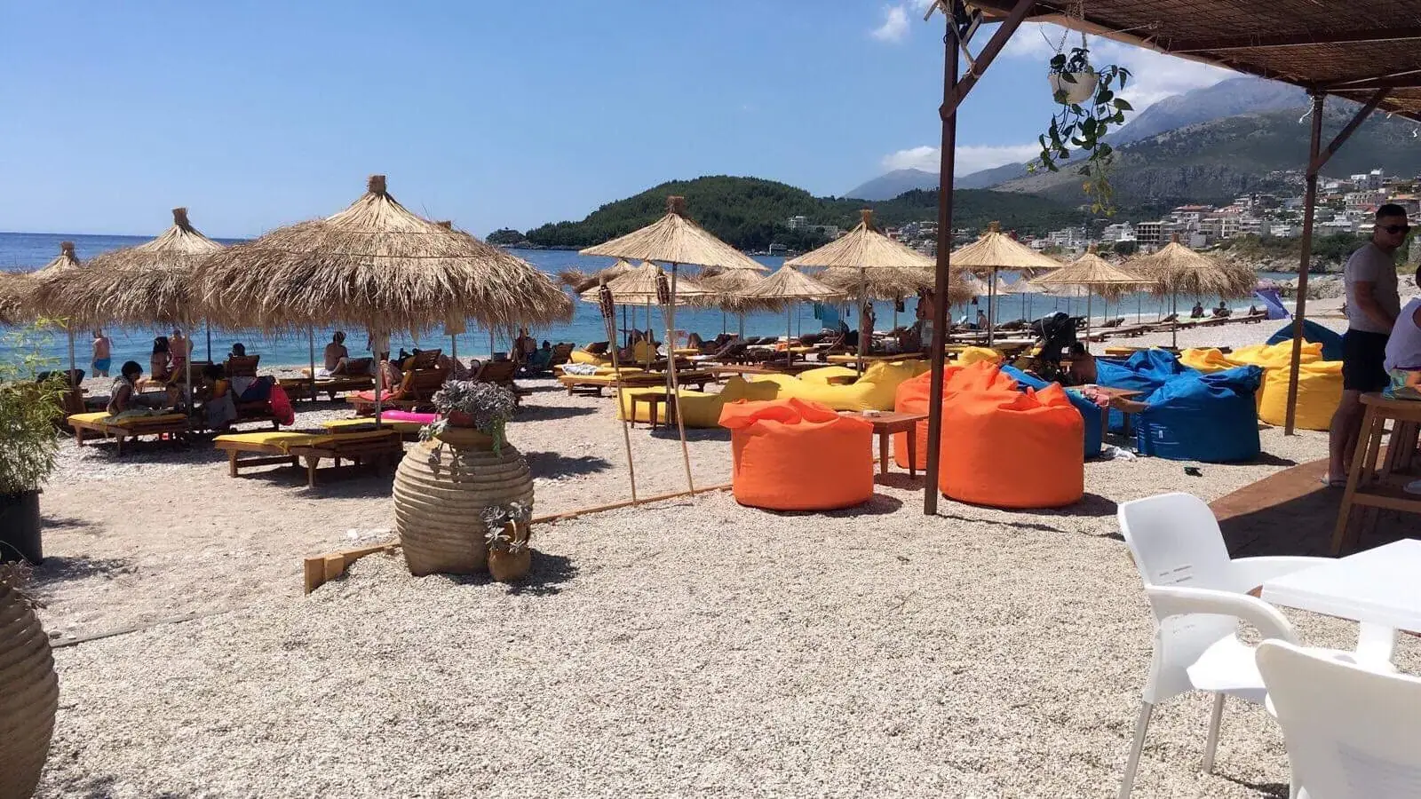 Varka Beach Bar's colorful bean bags and thatched umbrellas on Potami Beach