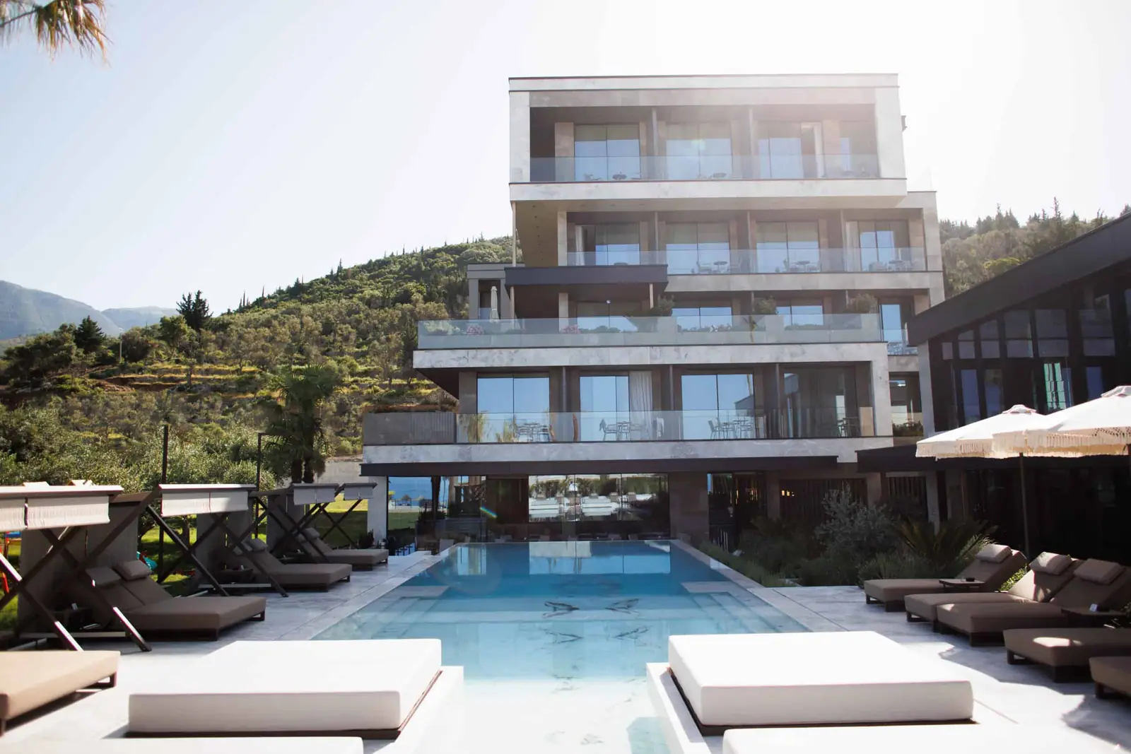 Infinity pool at Prado Luxury Hotel overlooking Livadhi Beach and the Ionian Sea