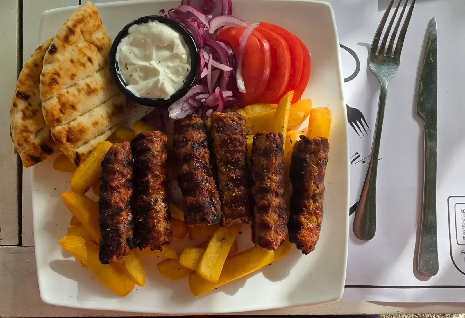 Evening diners at Brothers Grill outdoor taverna in Himara