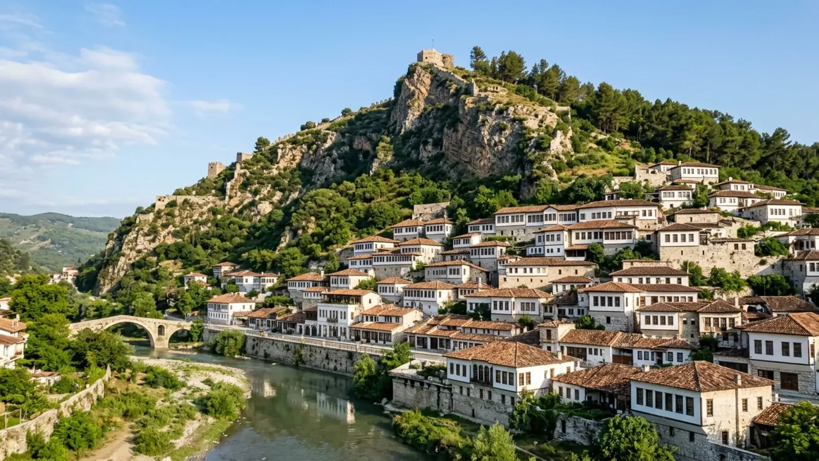 Berat's stacked white Ottoman houses climbing the hillside above the river