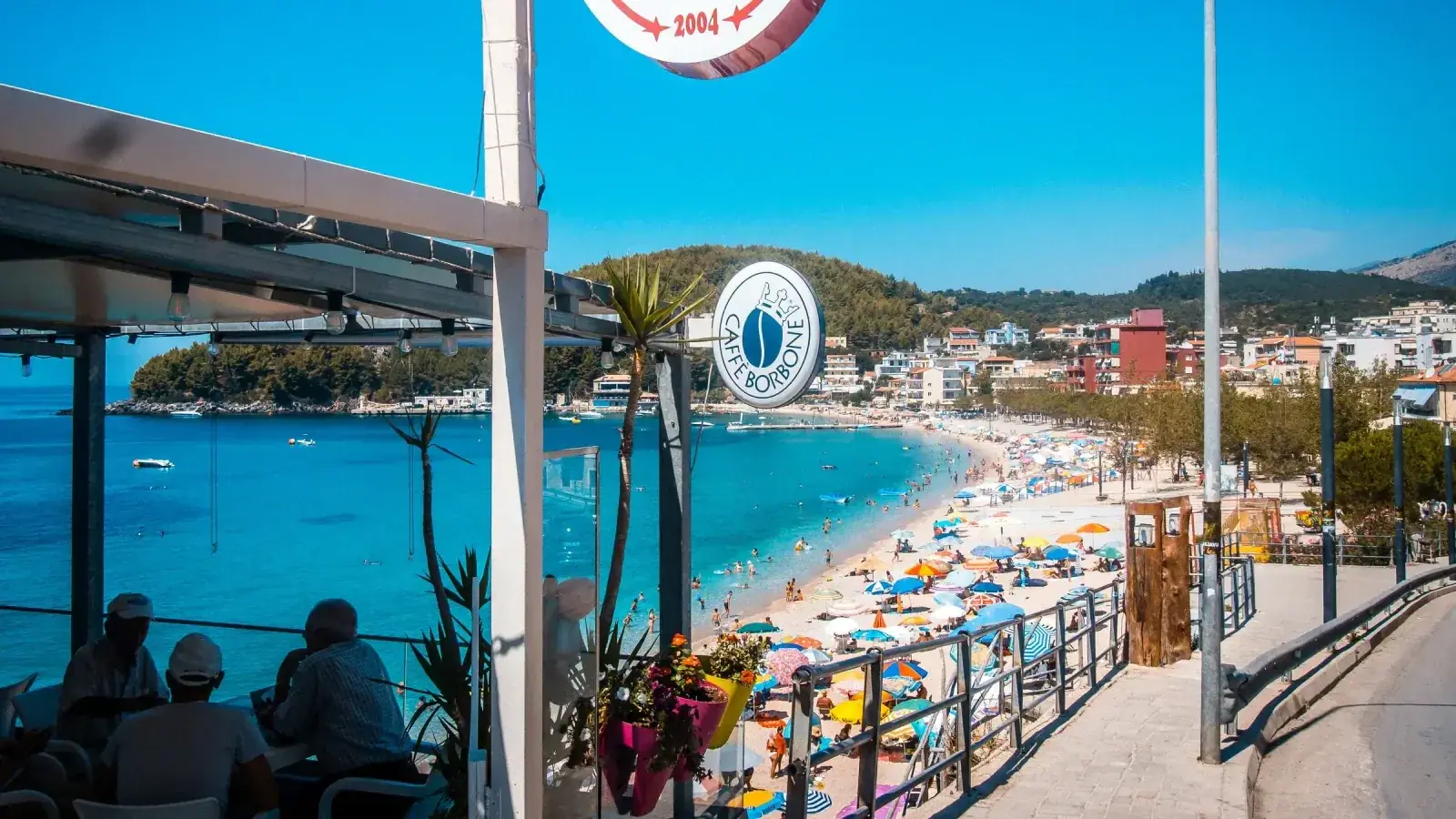 A shaded restaurant terrace looking over Spile beach in Himara