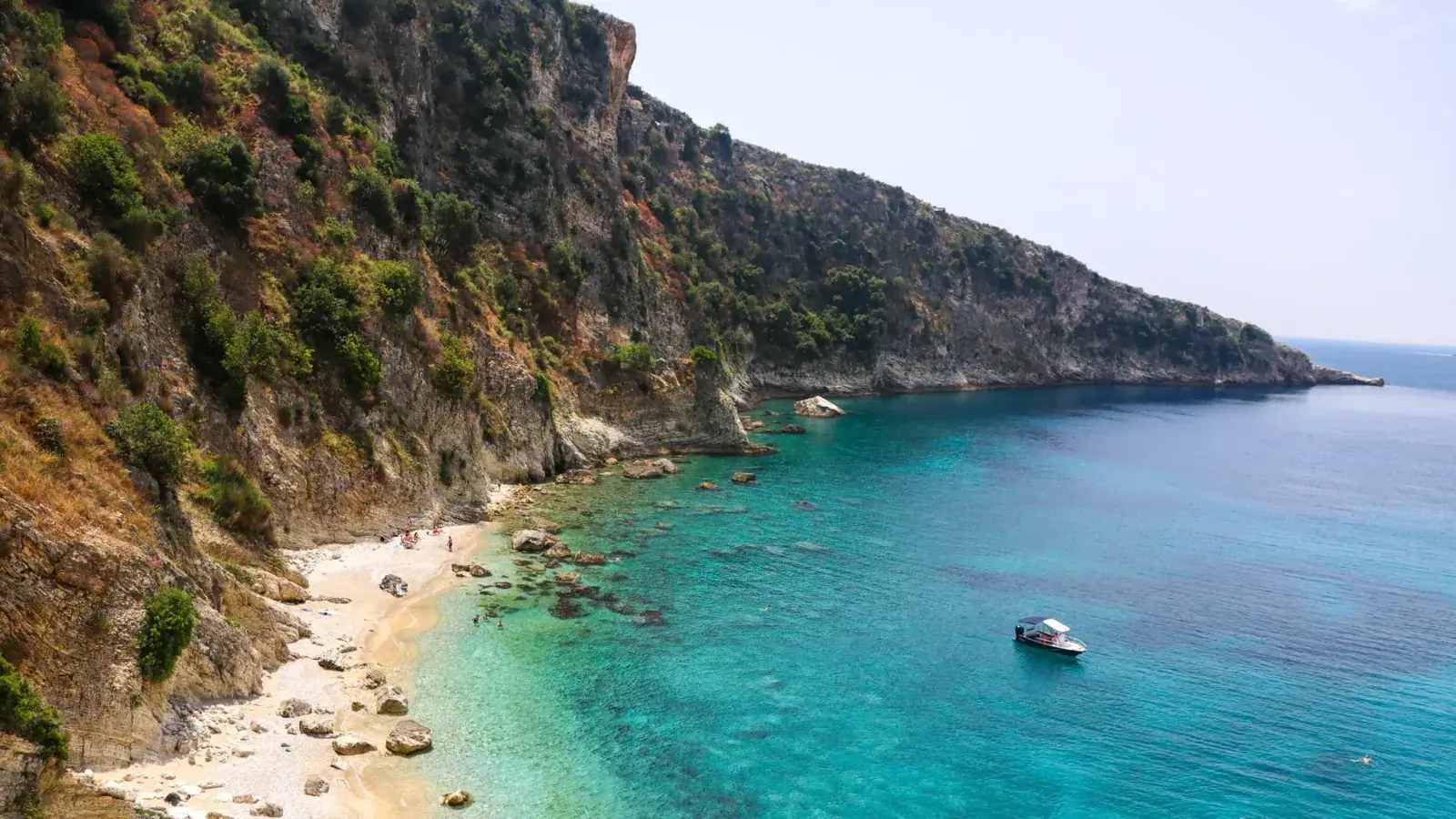 Crystal-clear turquoise water at Filikuri Beach ideal for snorkeling