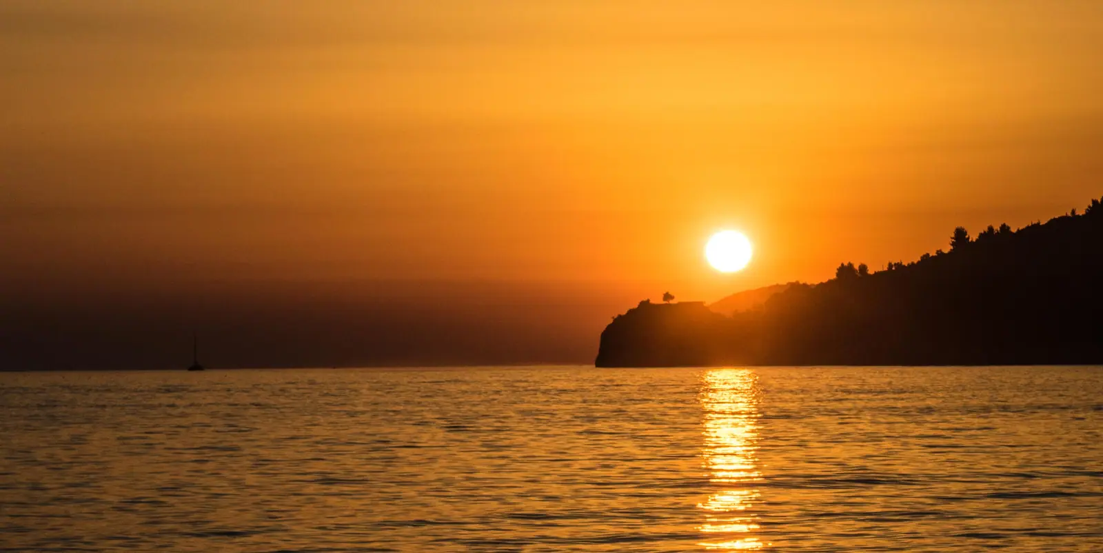 Sunset over the Ionian Sea near Potami Beach south of Himara