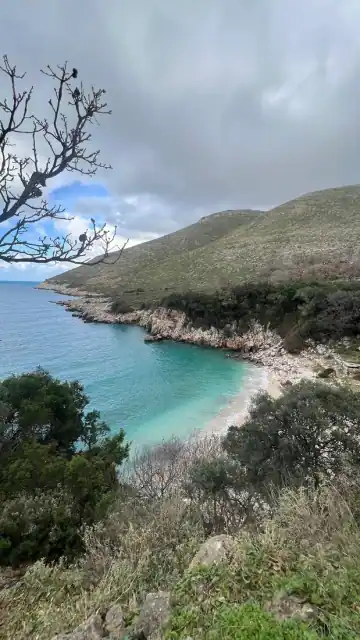 Bear's Bay cove below green Karaburun hillsides