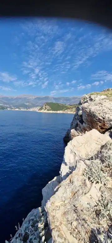 Cliffs at Cape of Rigon with the coast and settlement in the distance