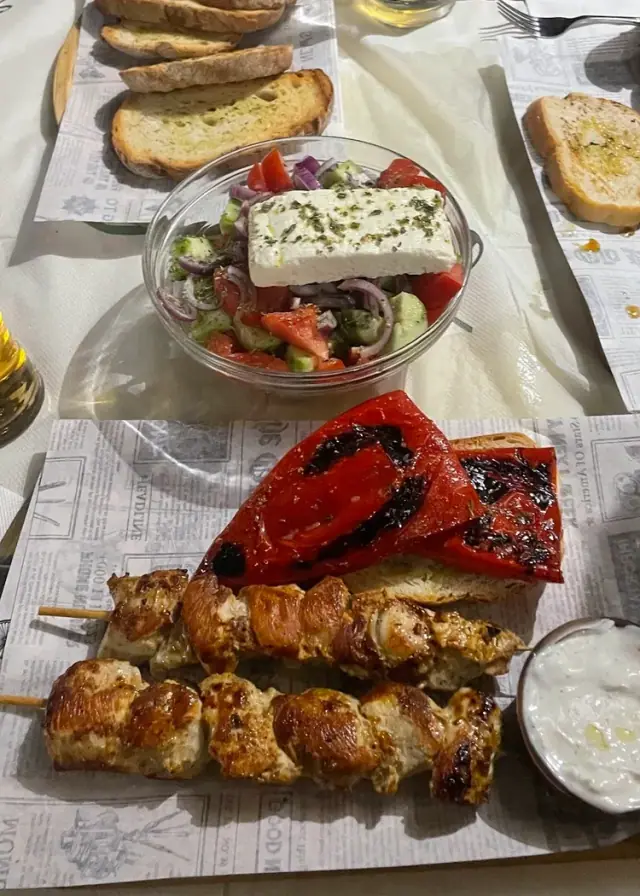 Two grilled chicken souvlaki skewers with roast red peppers, tzatziki and a Greek salad at Bar 300