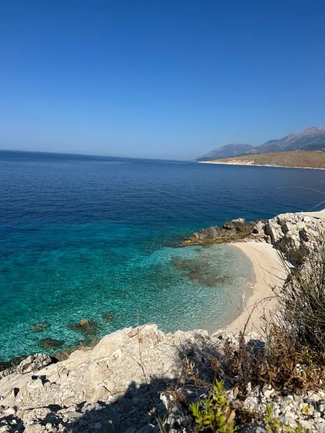 Small white-pebble cove and clear turquoise water at Amallos Beach