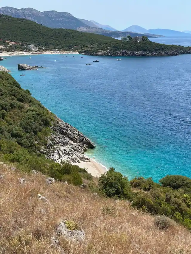 Crystal Beach cove seen from the hillside, clear water against the headland