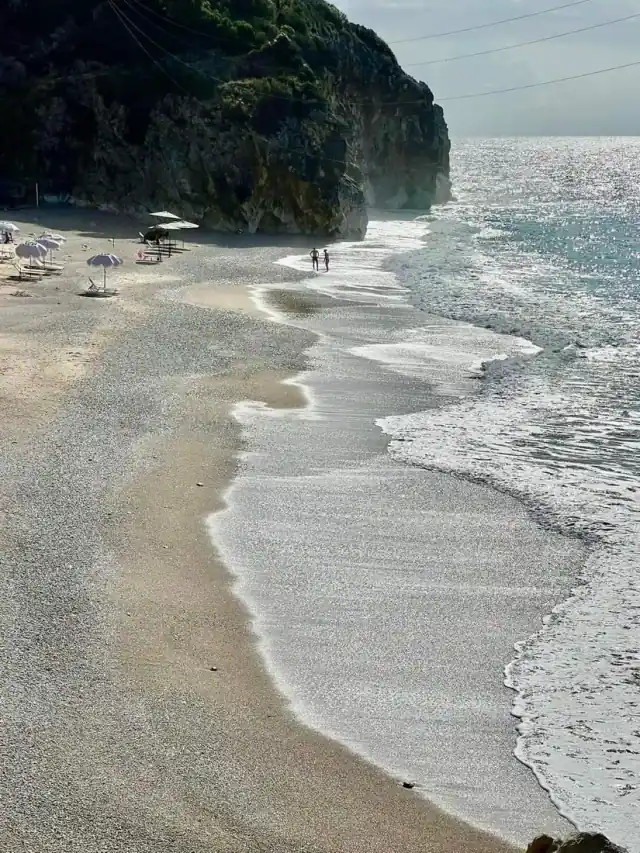 Surf on the pebble beach at the mouth of Gjipe Canyon
