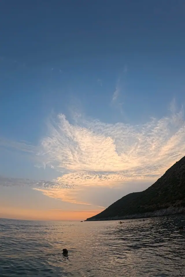 Coastal sunset view near Palasa on the northern Albanian Riviera with mountain silhouette