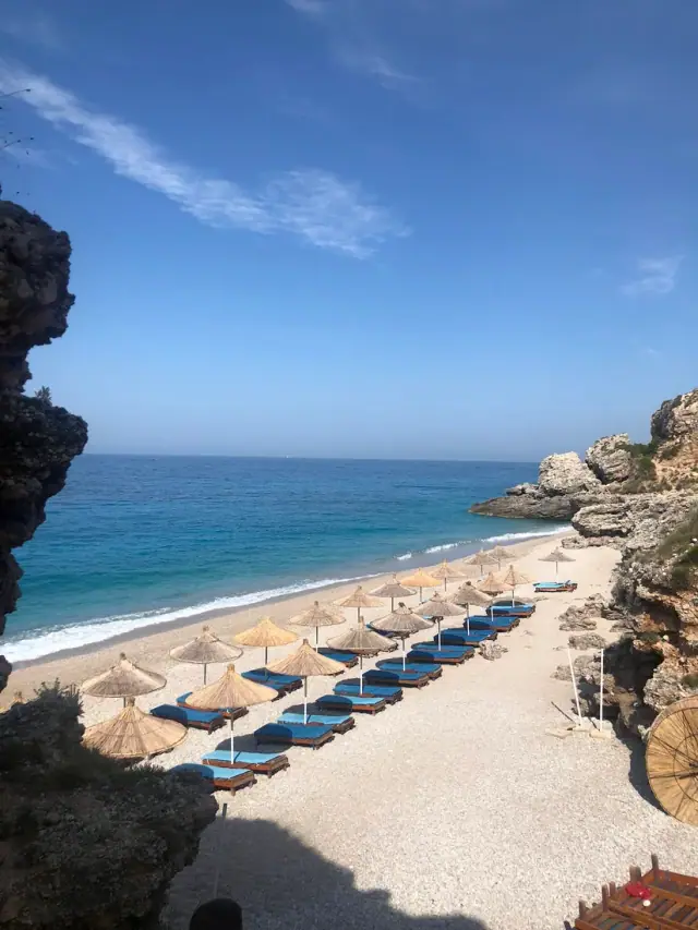 Umbrellas and loungers laid out along Palasa Beach