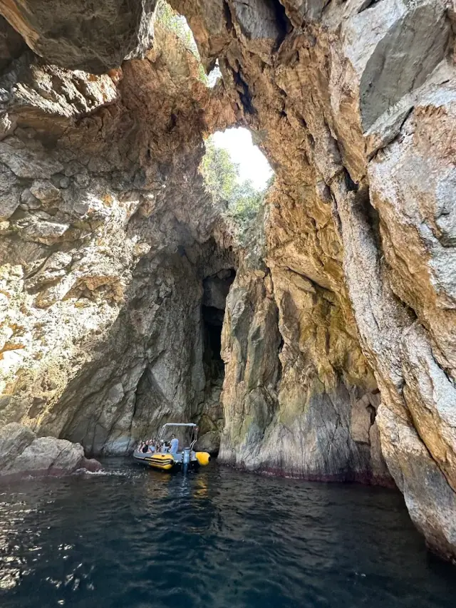 Private boat moored in clear water off the Himara coastline, Albanian Riviera