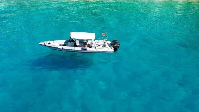 Sea Breeze Tours boat cruising the Himara coastline on the Albanian Riviera